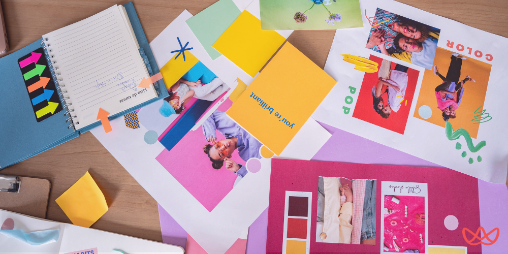 Talent hiring concept with colorful mood boards and creative project planning materials spread on a wooden table.