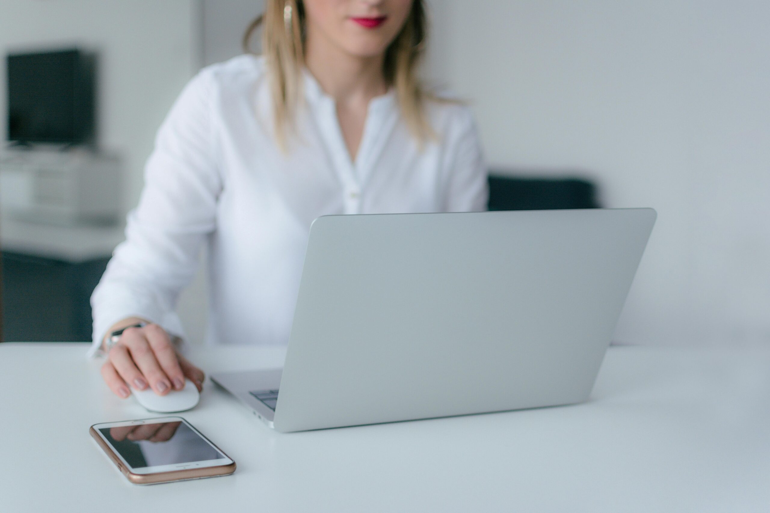 Professional woman working remotely on a laptop.