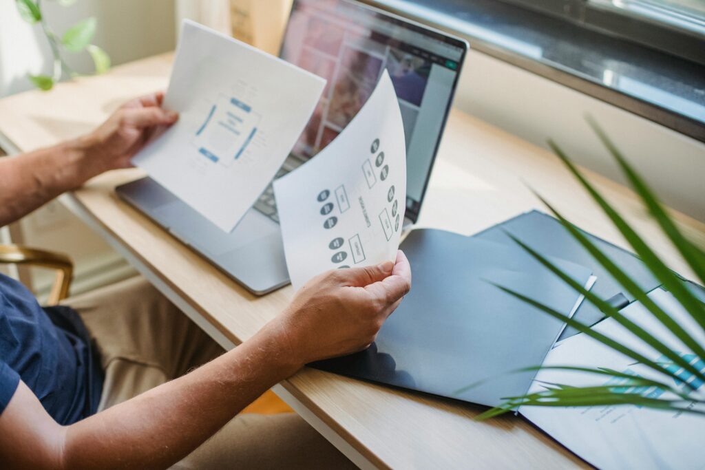 A person analyzing charts and data on travel workflows, emphasizing the strategic planning capabilities of a tourism online assistant for travel companies.