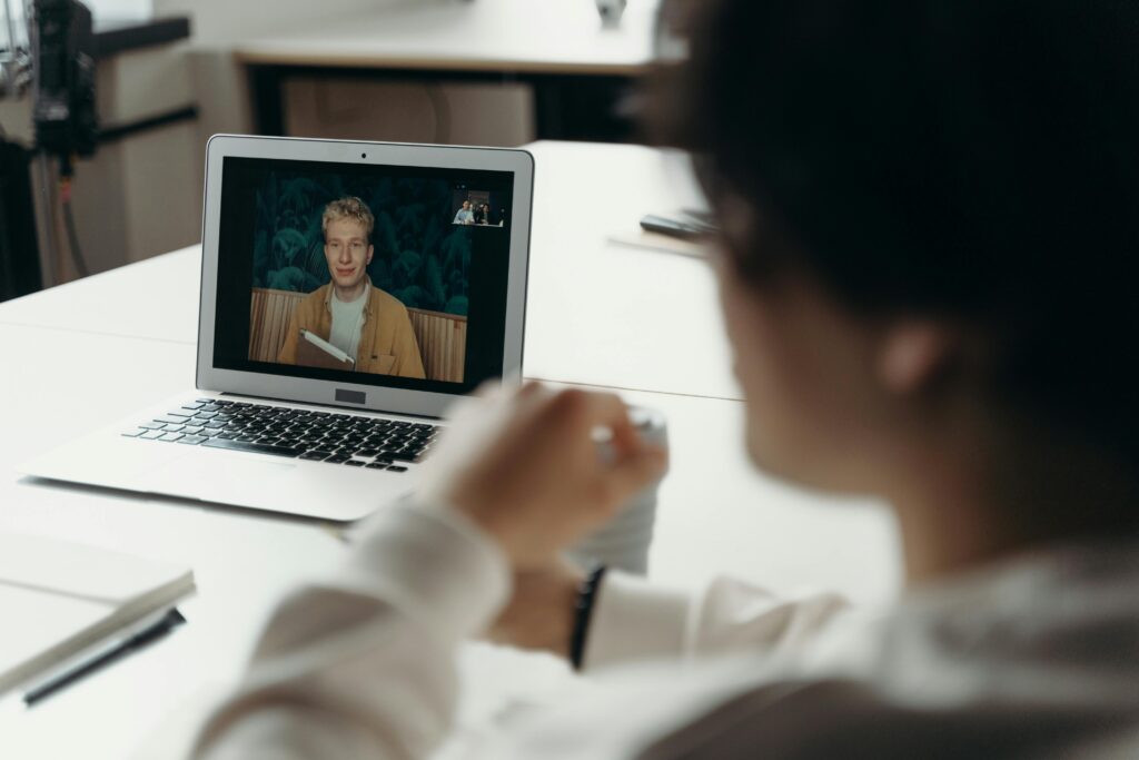 A virtual meeting showcasing two professionals discussing global outsourcing opportunities and strategies.