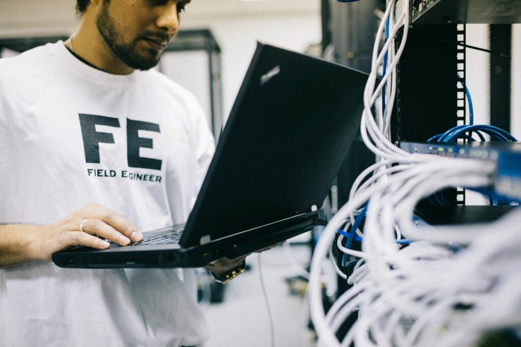 Field engineer configuring servers as part of outsourced network management services.