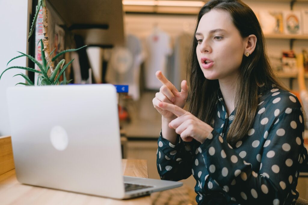 A professional discussing strategies for global outsourcing during a remote video meeting.