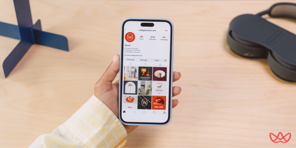 A smartphone displaying a social media profile page with posts promoting home decor, showcasing the social media manager key skills summary in crafting engaging and visually appealing content.