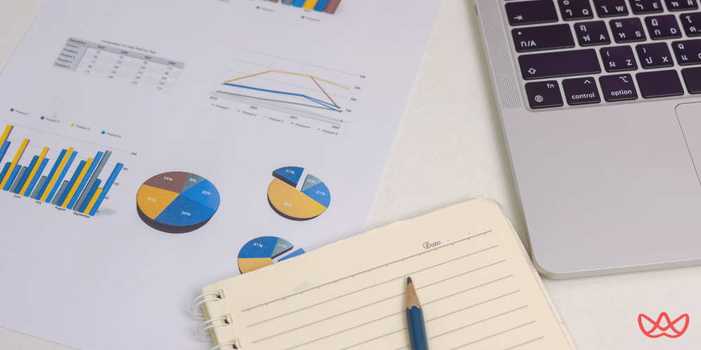 Workspace featuring an Affiliate Marketing Manager Resume Template with charts, graphs, and analytical tools arranged on a desk.