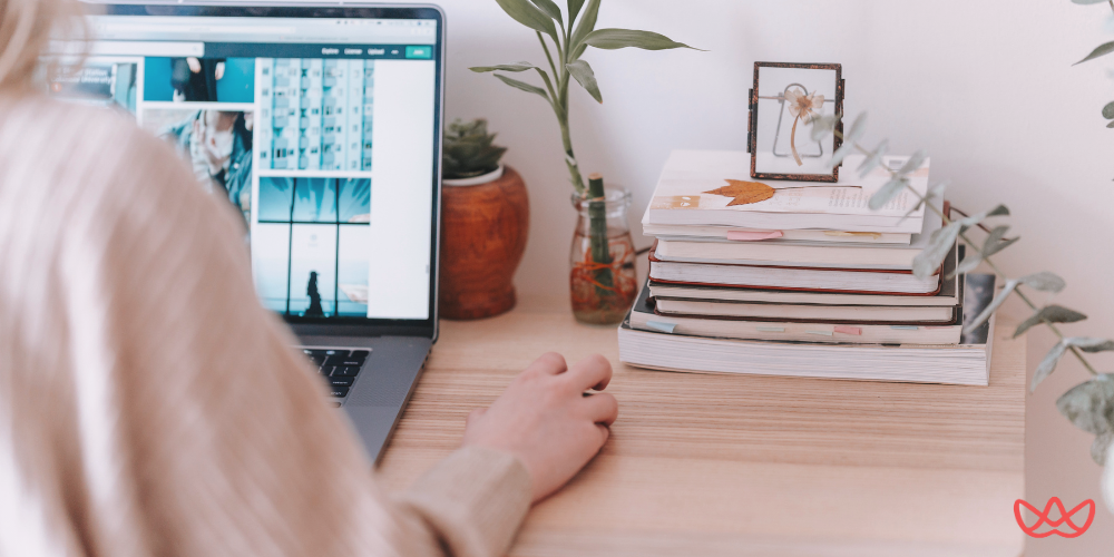 Professional working at organized desk setup while researching what is an executive assistant and where can you hire one.